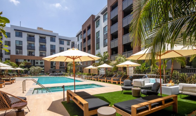 pool and lounge chairs with umbrellas