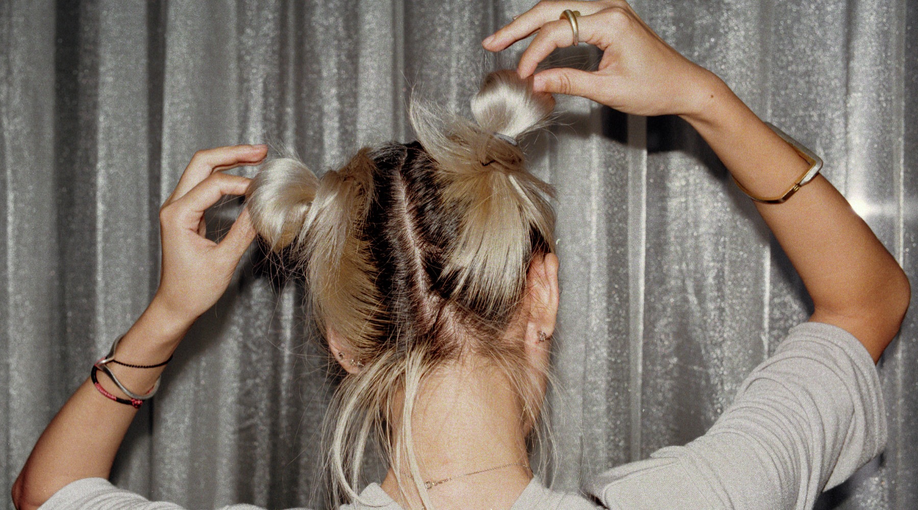 Woman posing and fixing her hair 
